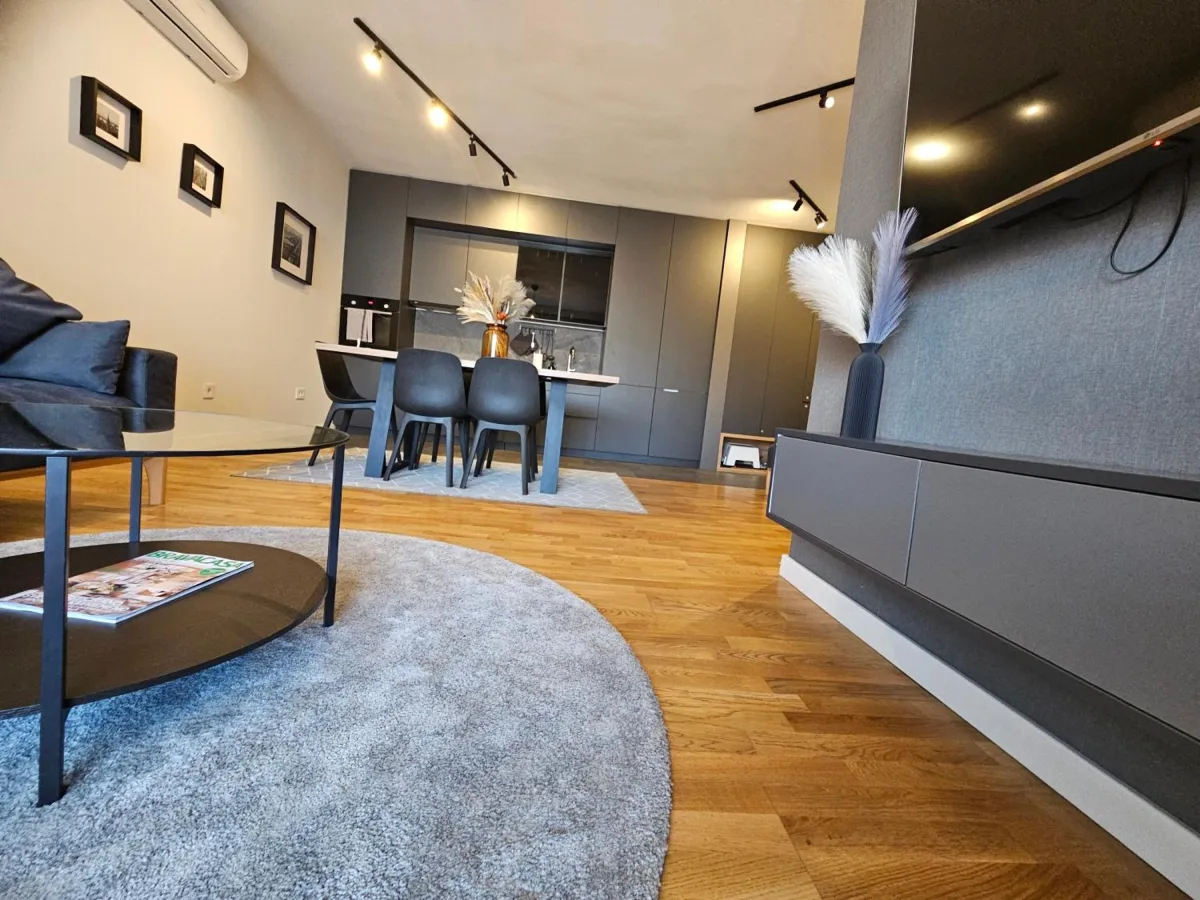 Open-plan living room in West Side 99 in central Niš